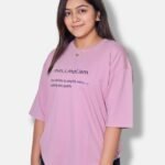 oversize t-shirt minimal oversize t-shirt model wearing oversize tshirt in simple pose minimal oversize clothing brand pastel pink color oversize tshirt